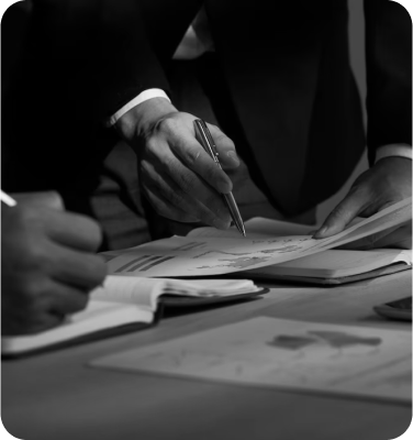 Zoomed images on person writing on paper